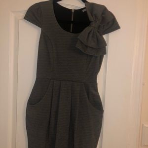 Dressed with bow and pockets